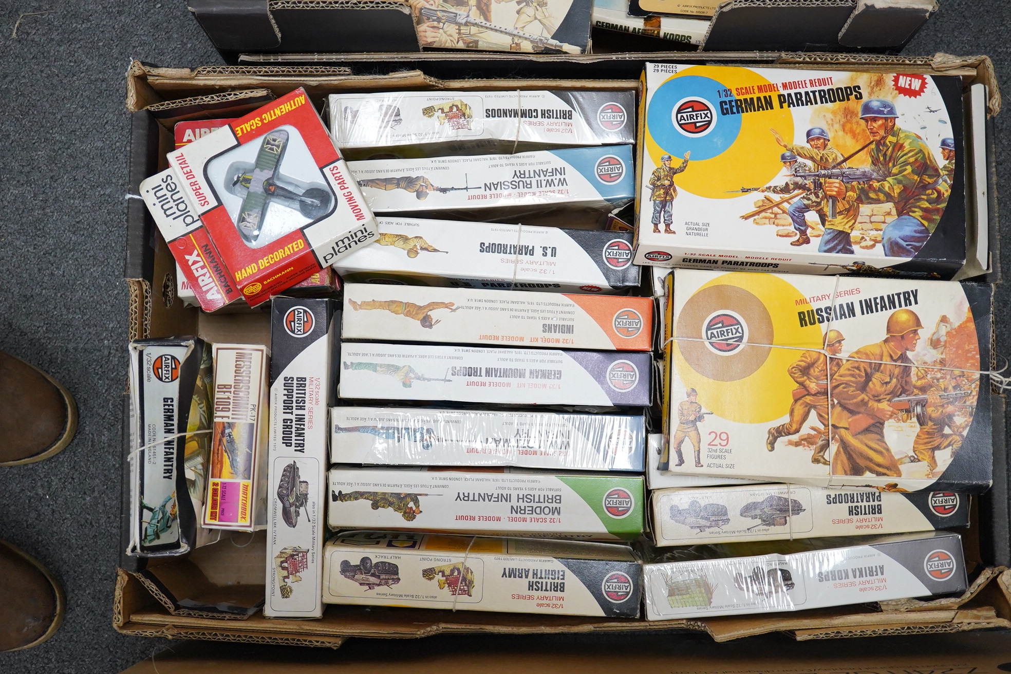 A collection of 1970s boxed Airfix 1:32 scale plastic WWII soldiers, Mainly British and German troops, Together with two Airfix clip-together Combat Packs, Battle Action scenes, and a Military Series Checkpoint, plus a L